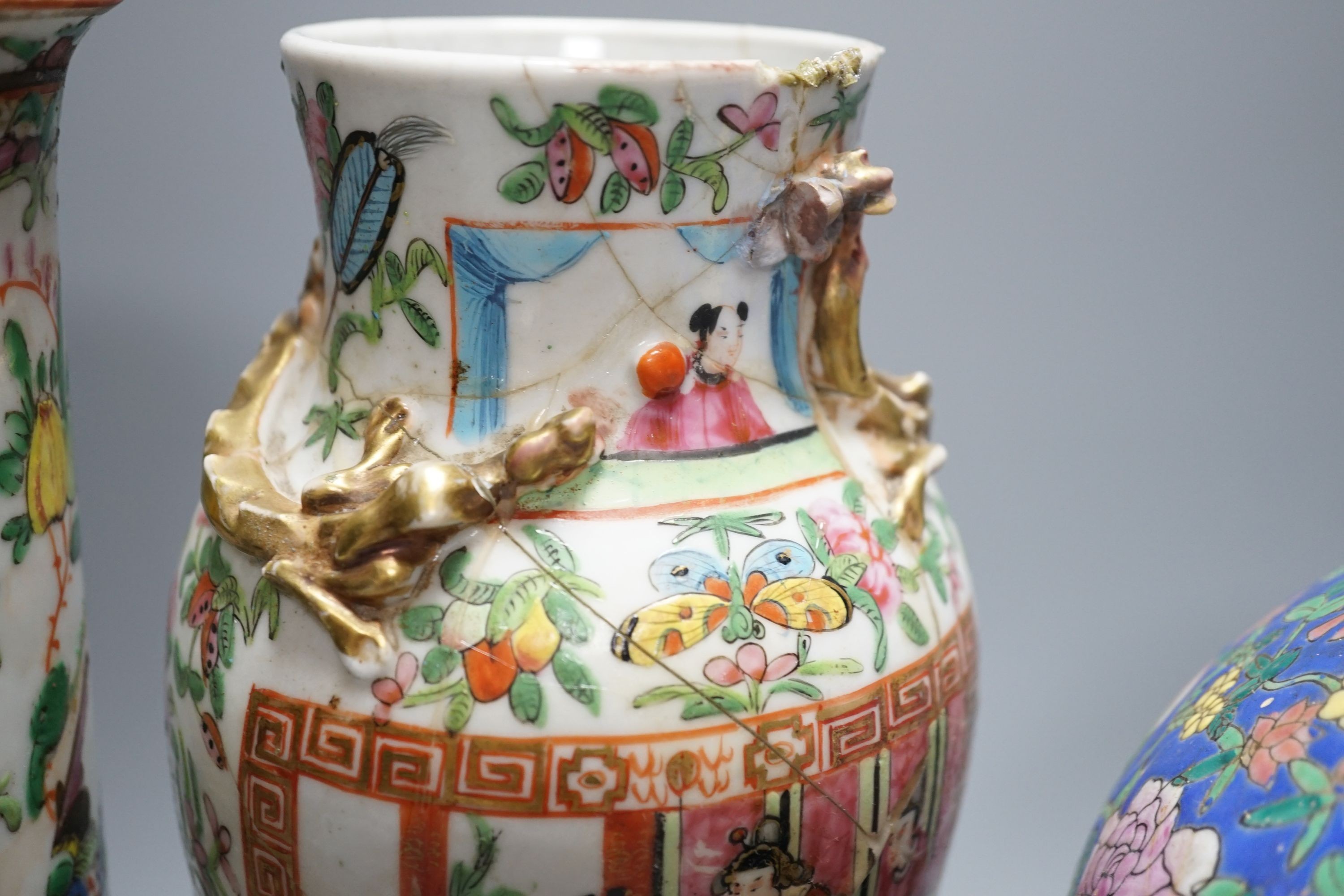Two Chinese famille rose vases, two Chinese famille rose teapots and a blue ground enamelled jar tallest 26.5cm